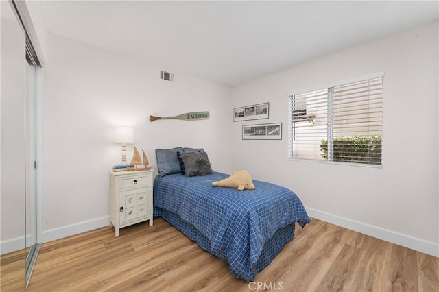 43 La Sordina, Rancho Santa Margarita, CA 92688 - bedroom with baseboards, wood finished floors, and a closet