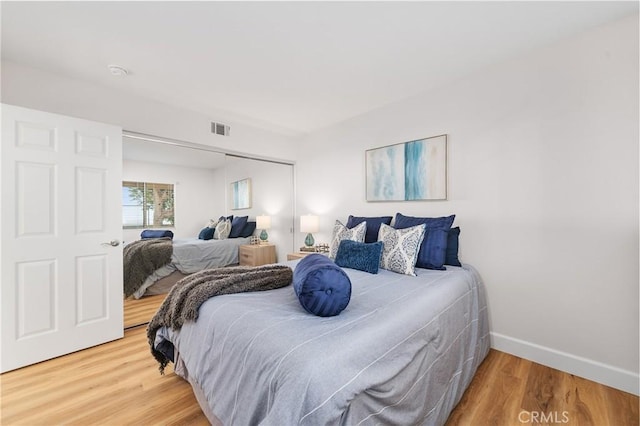 43 La Sordina, Rancho Santa Margarita, CA 92688 - bedroom featuring wood finished floors, a closet, and baseboards