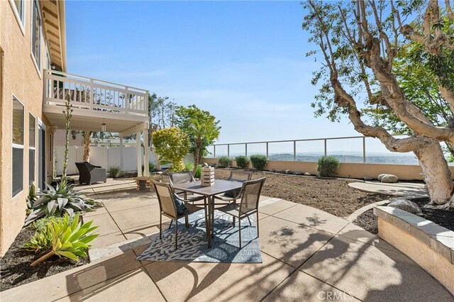 43 La Sordina, Rancho Santa Margarita, CA 92688 - view of patio with outdoor dining area, a fenced backyard, and a balcony