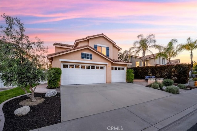 43 La Sordina, Rancho Santa Margarita, CA 92688 - traditional-style house with concrete driveway, stucco siding, a tiled roof, and a garage