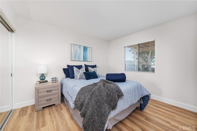 43 La Sordina, Rancho Santa Margarita, CA 92688 - bedroom featuring baseboards and light wood-style floors