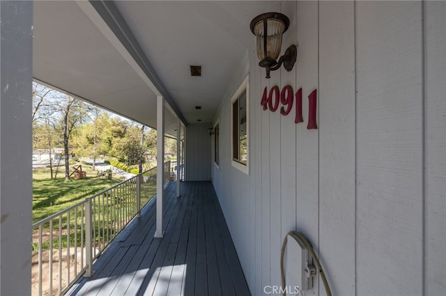 wooden terrace featuring covered porch