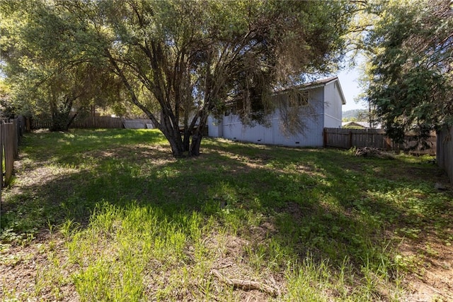 view of yard with a fenced backyard