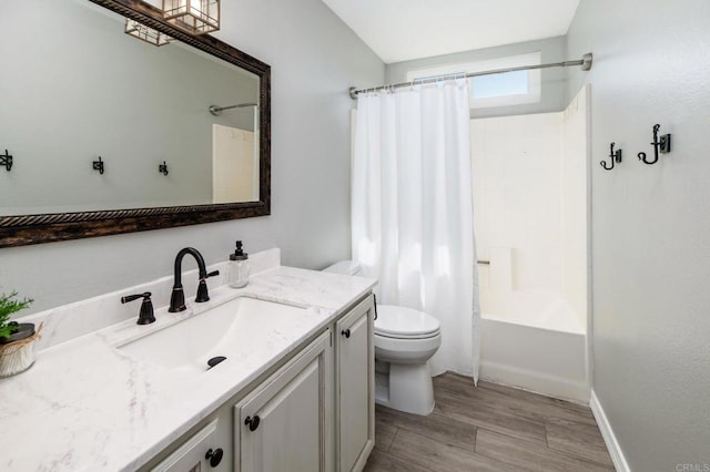 bathroom featuring vanity, shower / bath combo with shower curtain, toilet, and wood finished floors