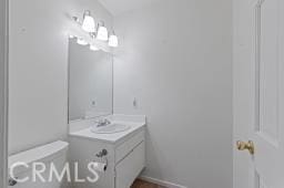 25723 Player Dr, Valencia, CA 91355 - bathroom with toilet, vanity, and baseboards