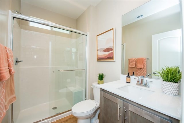 11534 Alana Ln, Beaumont, CA 92223 - full bathroom with toilet, visible vents, vanity, and a stall shower
