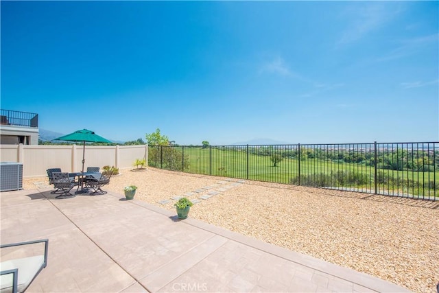 11534 Alana Ln, Beaumont, CA 92223 - view of patio / terrace featuring cooling unit, outdoor dining space, and a fenced backyard