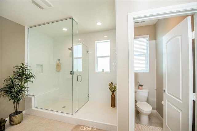 11534 Alana Ln, Beaumont, CA 92223 - full bath with visible vents, tile patterned flooring, a shower stall, and toilet
