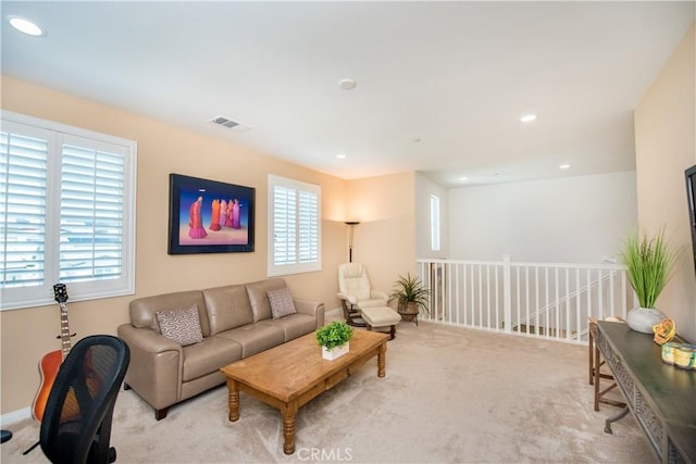 11534 Alana Ln, Beaumont, CA 92223 - living room featuring baseboards, visible vents, carpet floors, and recessed lighting