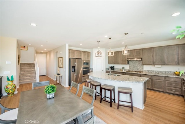 11534 Alana Ln, Beaumont, CA 92223 - dining room featuring recessed lighting, stairway, baseboards, and light wood-type flooring