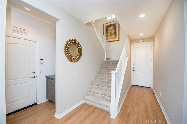 11534 Alana Ln, Beaumont, CA 92223 - entrance foyer featuring recessed lighting, baseboards, light wood finished floors, and stairs