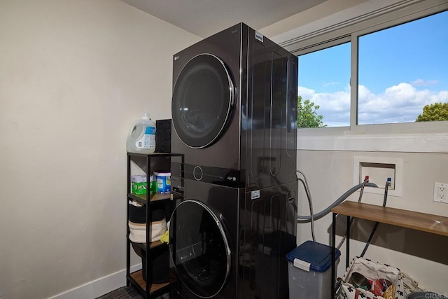 1105 Fulton Rd, San Marcos, CA 92069 - washroom featuring baseboards, stacked washer / dryer, and laundry area