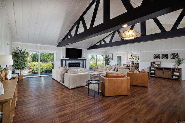 1105 Fulton Rd, San Marcos, CA 92069 - living room featuring high vaulted ceiling, a glass covered fireplace, plenty of natural light, and dark wood-style floors