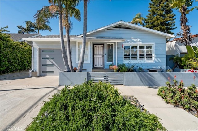 4723 E 3rd St, Long Beach, CA 90814 - view of front of house with an attached garage, a porch, driveway, and a fenced front yard