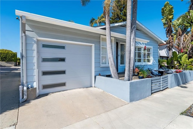 4723 E 3rd St, Long Beach, CA 90814 - view of front of property with a garage and concrete driveway