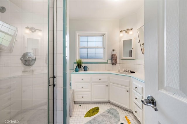 4723 E 3rd St, Long Beach, CA 90814 - bathroom featuring tile patterned floors, tiled shower, decorative backsplash, and vanity