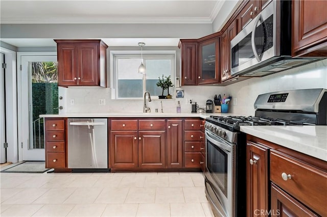 4723 E 3rd St, Long Beach, CA 90814 - kitchen with ornamental molding, a sink, appliances with stainless steel finishes, and light countertops