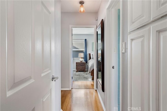 4723 E 3rd St, Long Beach, CA 90814 - corridor with baseboards and light wood finished floors