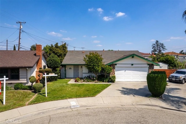 ranch-style house featuring a garage, driveway, and a front lawn