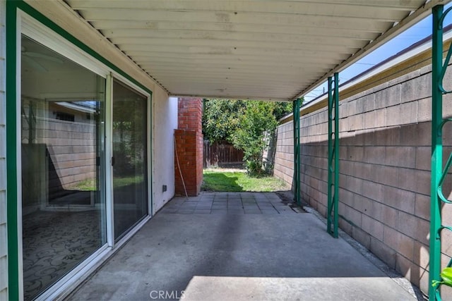 view of patio / terrace featuring fence