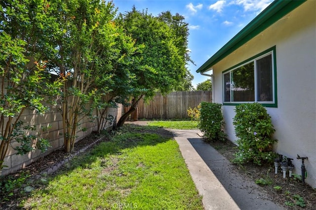 view of yard with a fenced backyard