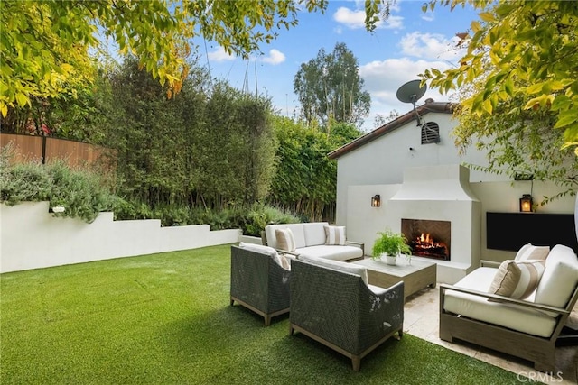 exterior space featuring a patio area, fence, and an outdoor living space with a fireplace