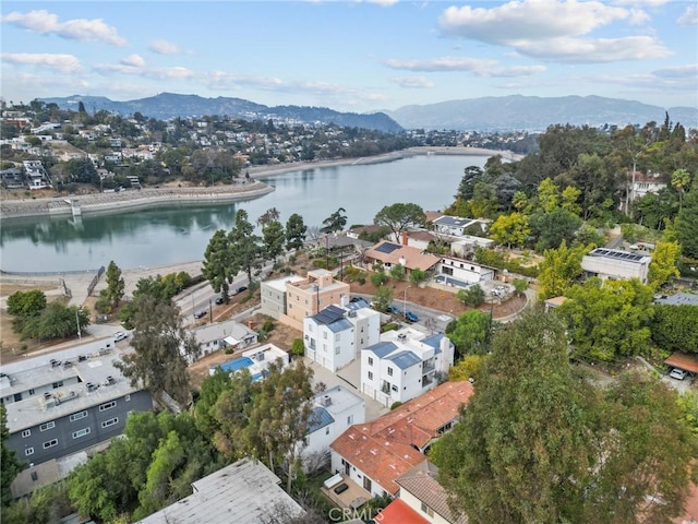aerial view featuring a water and mountain view