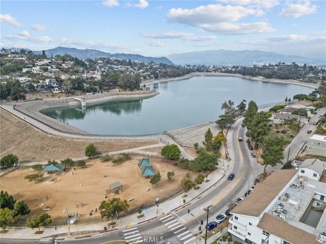 bird's eye view with a water and mountain view