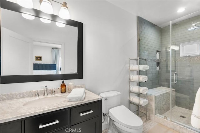 full bath featuring tile patterned floors, a stall shower, toilet, recessed lighting, and vanity