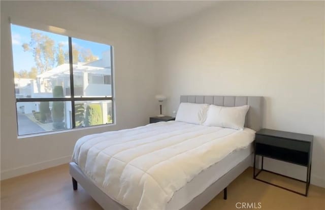 bedroom featuring baseboards
