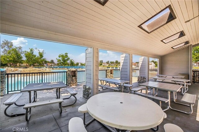 15 Waterway Unit 11, Irvine, CA 92614 - view of patio / terrace featuring outdoor dining space and a water view