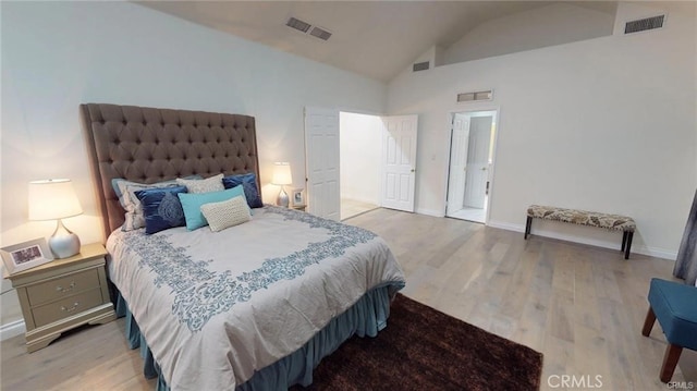 bedroom with visible vents and light wood-style floors