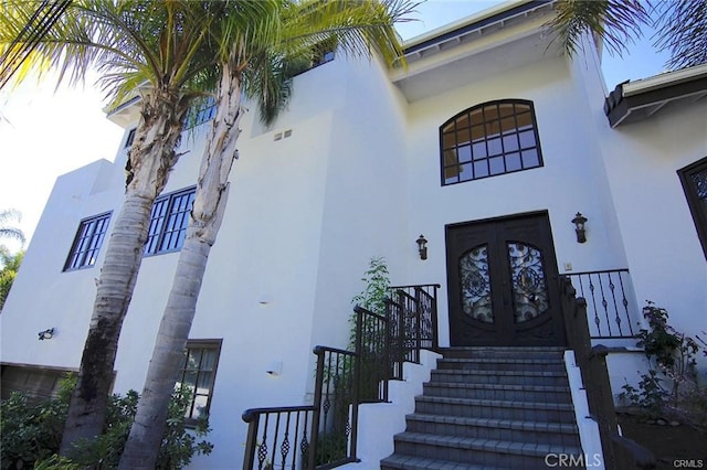 15020 Encanto Dr, Sherman Oaks, CA 91403 - view of exterior entry featuring stucco siding and french doors