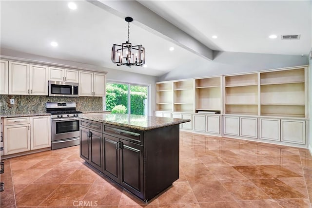 kitchen featuring vaulted ceiling with beams, appliances with stainless steel finishes, a notable chandelier, light stone countertops, and visible vents