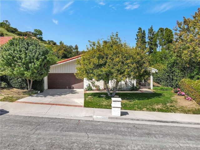 obstructed view of property featuring a front lawn