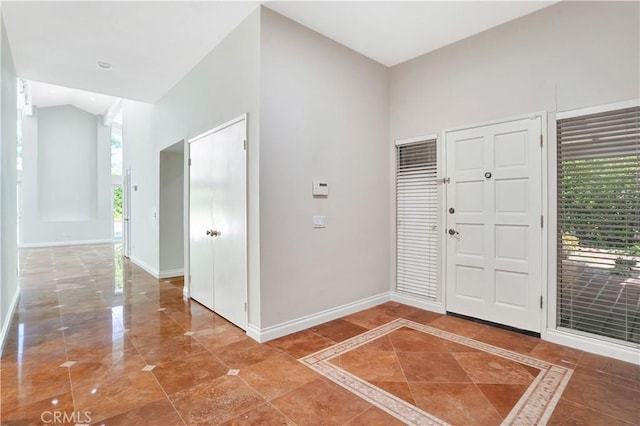 entryway with baseboards and a healthy amount of sunlight