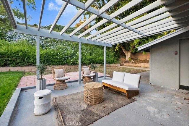 view of patio / terrace with outdoor lounge area, fence, and a pergola