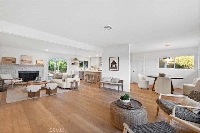 4421 Hempstead St, Simi Valley, CA 93063 - living room featuring light wood finished floors, a fireplace, and recessed lighting