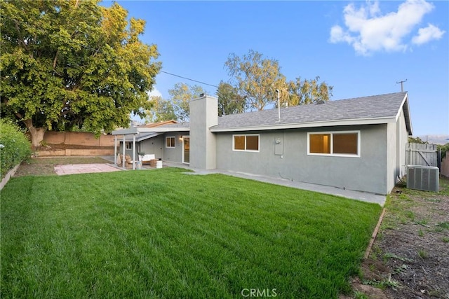 4421 Hempstead St, Simi Valley, CA 93063 - rear view of property featuring cooling unit, a patio area, a chimney, stucco siding, and roof with shingles