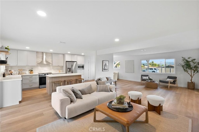 4421 Hempstead St, Simi Valley, CA 93063 - living room with recessed lighting, light wood-style floors, and baseboards