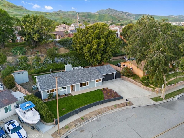 drone / aerial view with a residential view and a mountain view