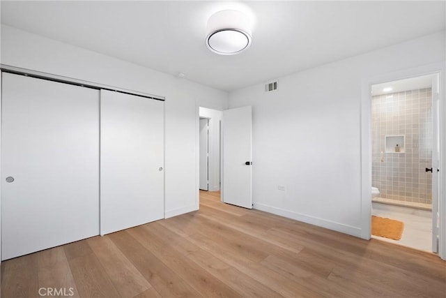 4421 Hempstead St, Simi Valley, CA 93063 - unfurnished bedroom featuring light wood finished floors, a closet, connected bathroom, and baseboards