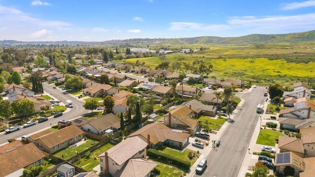drone / aerial view with a residential view and a mountain view