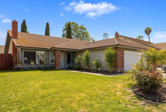 ranch-style house featuring a garage, fence, a tiled roof, and a front yard