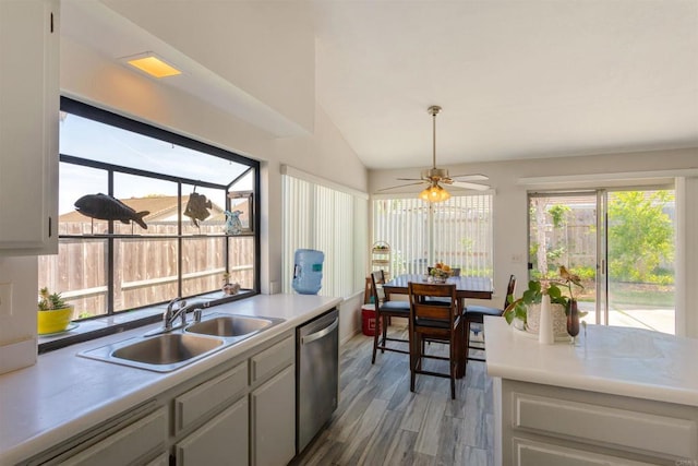 4413 Point Degada, Oceanside, CA 92058 - kitchen featuring stainless steel dishwasher, a sink, wood finished floors, ceiling fan, and vaulted ceiling