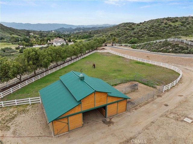 aerial view with a mountain view and a rural view