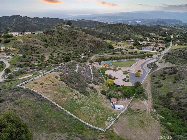birds eye view of property with a mountain view