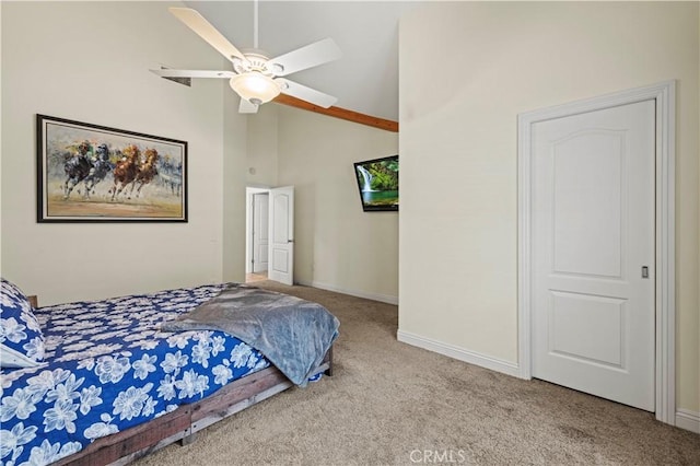carpeted bedroom featuring a ceiling fan, baseboards, and high vaulted ceiling