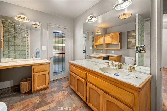 30052 Hunstock St, Castaic, CA 91384 - full bathroom featuring toilet, vanity, and stone finish floors