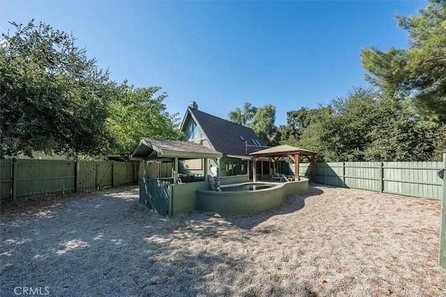 30052 Hunstock St, Castaic, CA 91384 - rear view of property featuring a gazebo and a fenced backyard